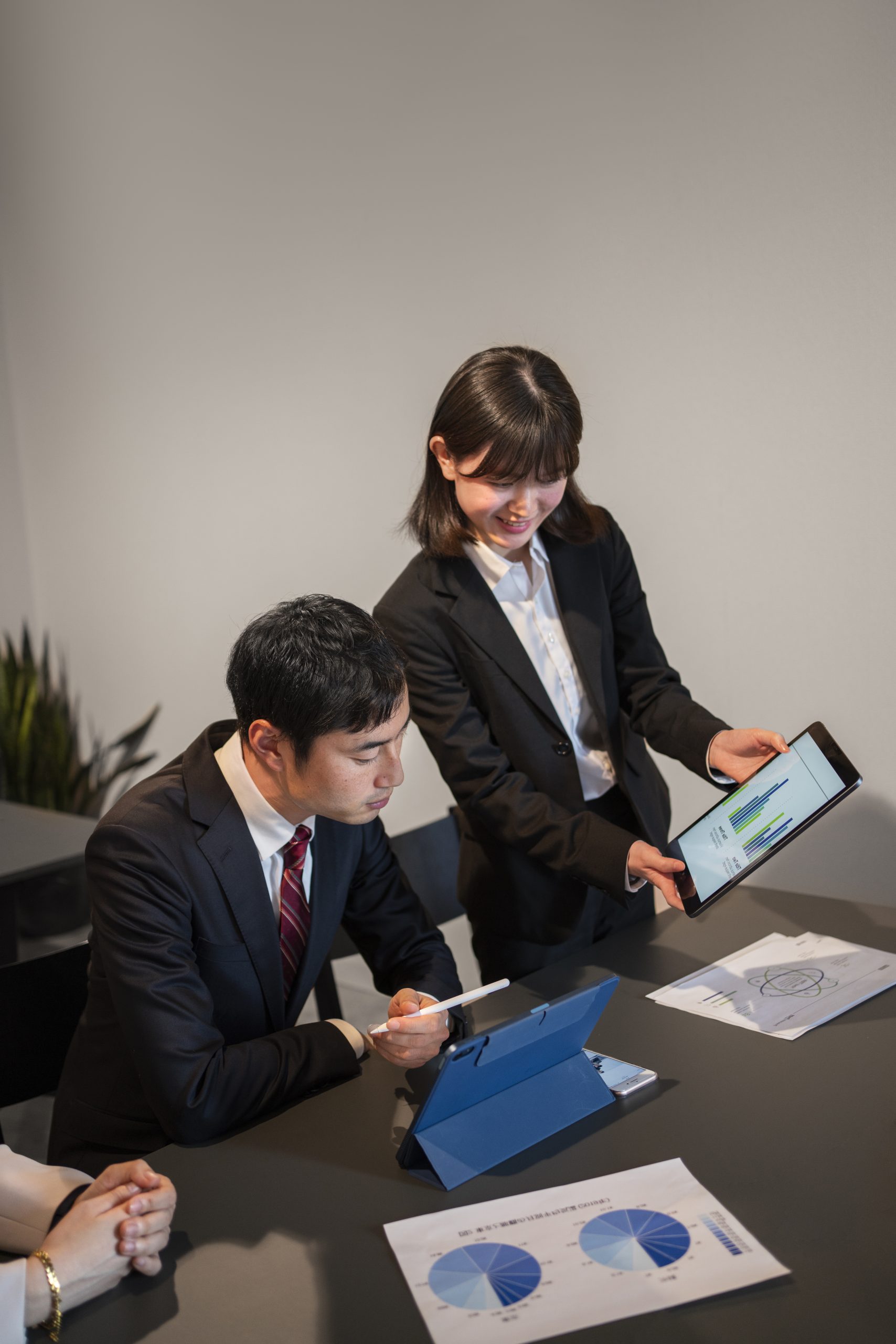 business-people-working-with-ipad-high-angle https://www.syntrio.in/wp-content/uploads/2025/09/business-people-working-with-ipad-high-angle-scaled.jpg